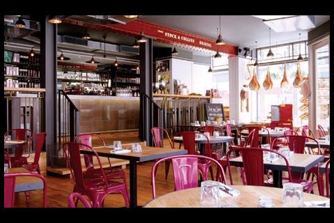 Rustic wood and pink Tolix chairs at Jamie’s Italian in Oxford, by MBDS.